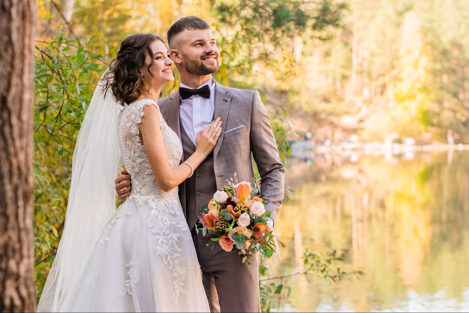 wedding couple beside a lake with suit